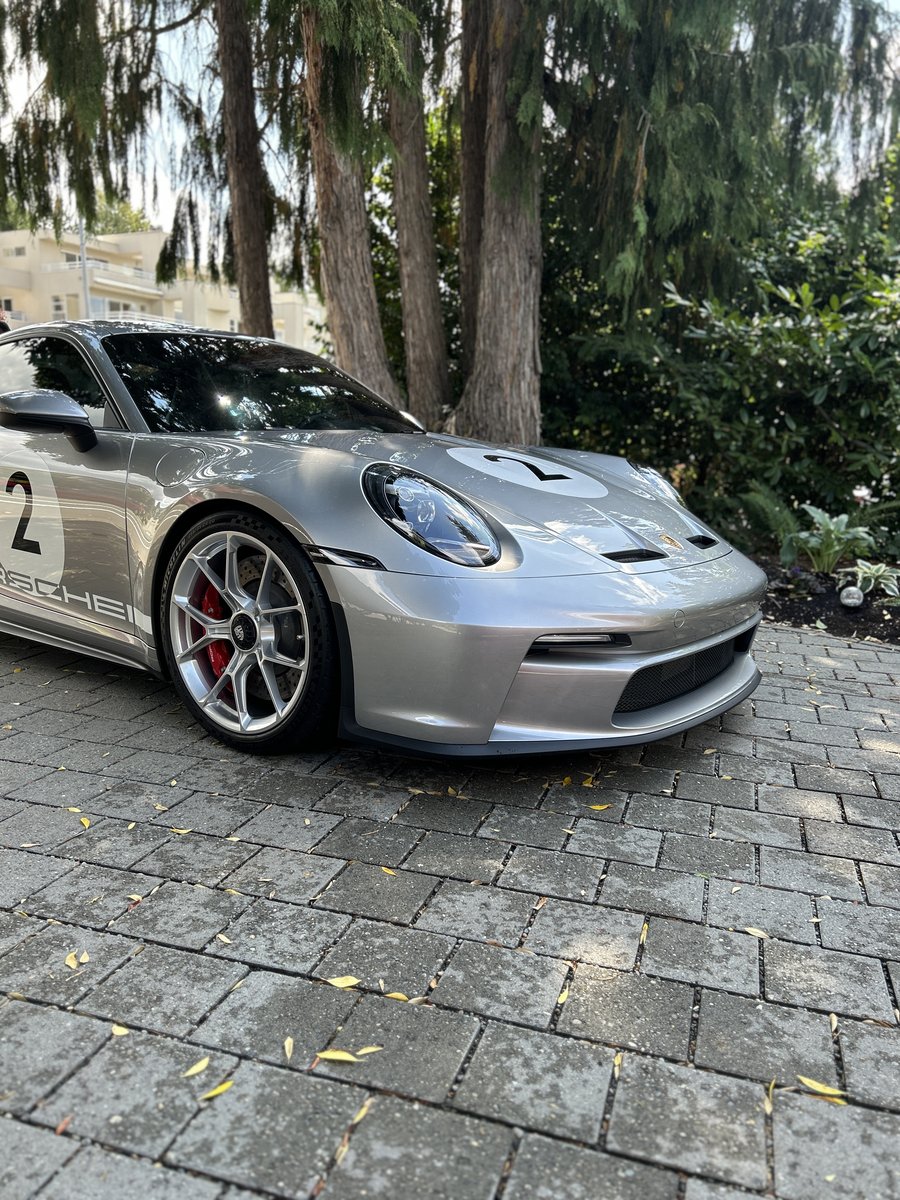 Owner's silver sports car charging with Ghost Guard